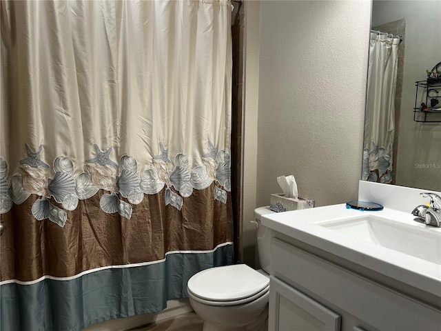 bathroom with oversized vanity and toilet