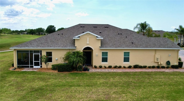 exterior space with a sunroom and a front lawn