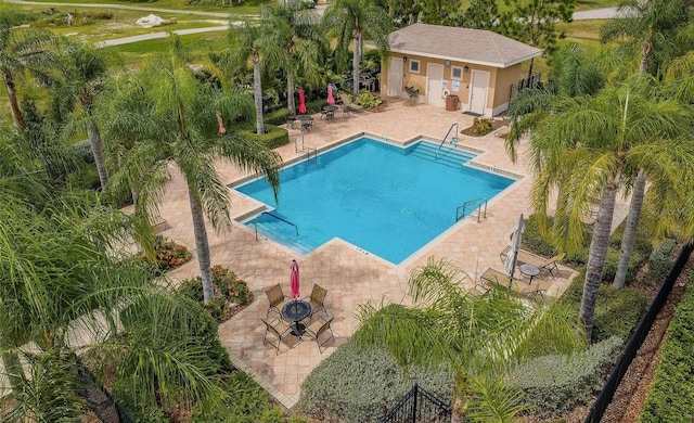 view of swimming pool featuring a patio area