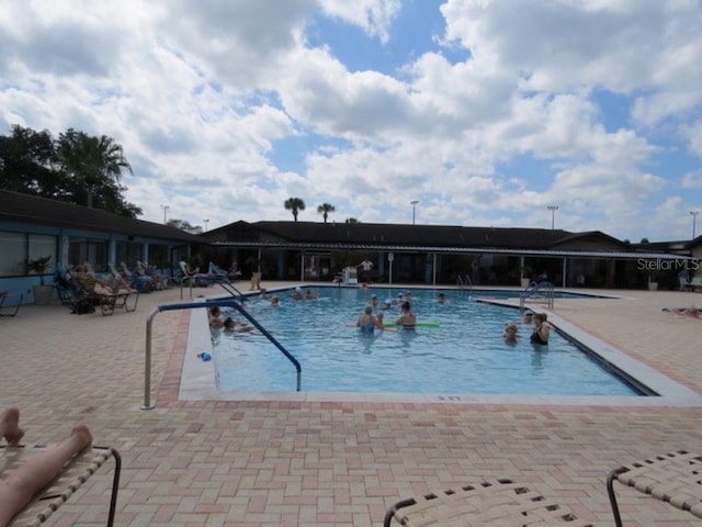 view of pool featuring a patio