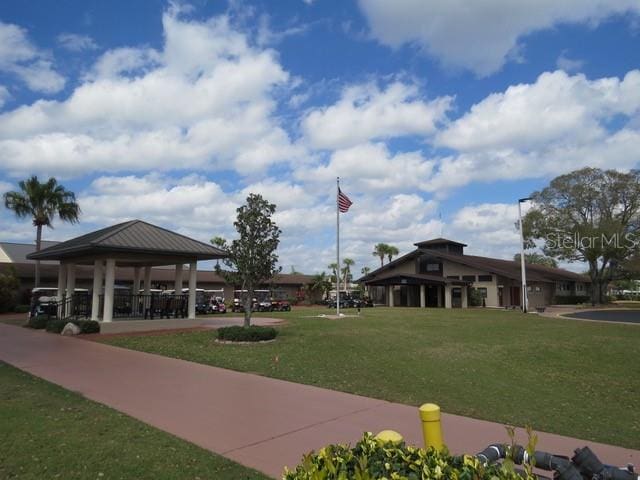 surrounding community with a gazebo and a yard