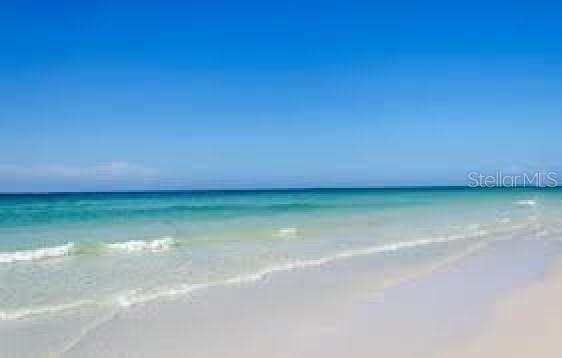 view of water feature with a beach view