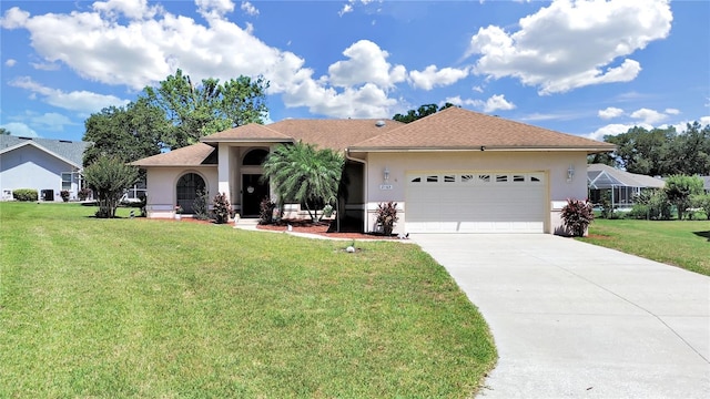 view of front of property featuring a front lawn and a garage