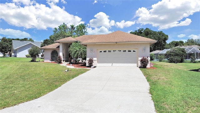 view of front facade with a garage and a front lawn