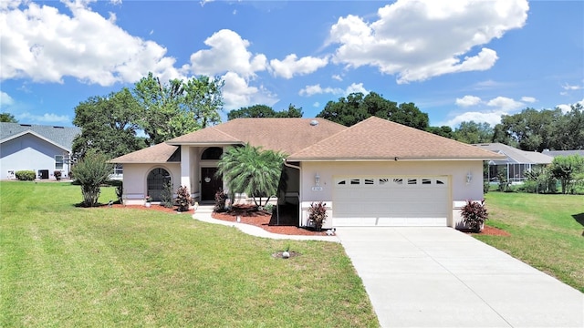 view of front facade with a front lawn and a garage