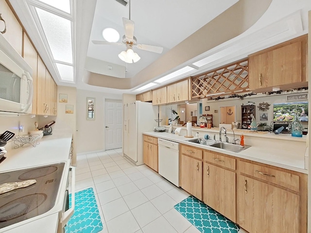 kitchen with light brown cabinets, ceiling fan, white appliances, light tile floors, and sink