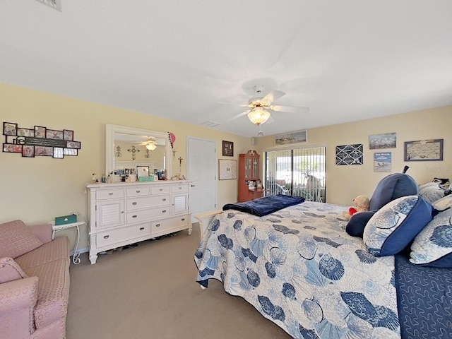 carpeted bedroom featuring ceiling fan