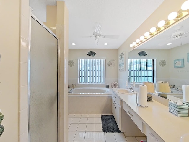 bathroom featuring dual vanity, tile floors, plus walk in shower, and ceiling fan