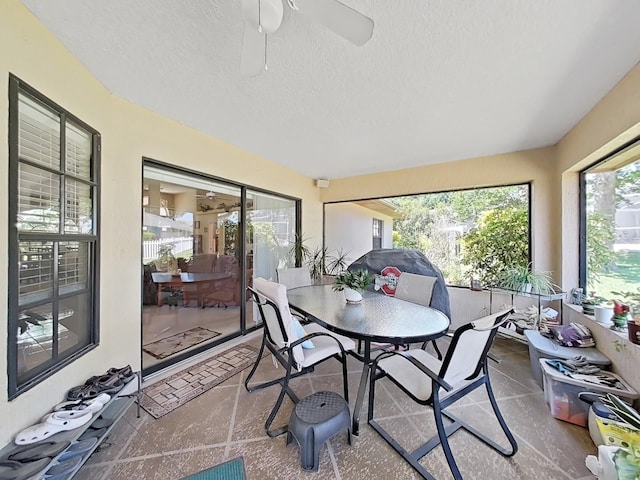 sunroom / solarium with ceiling fan