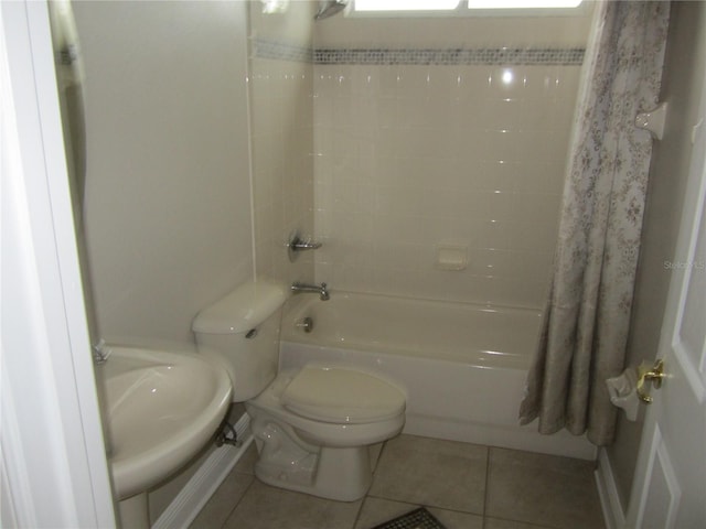 full bathroom featuring tile floors, sink, shower / tub combo, and toilet