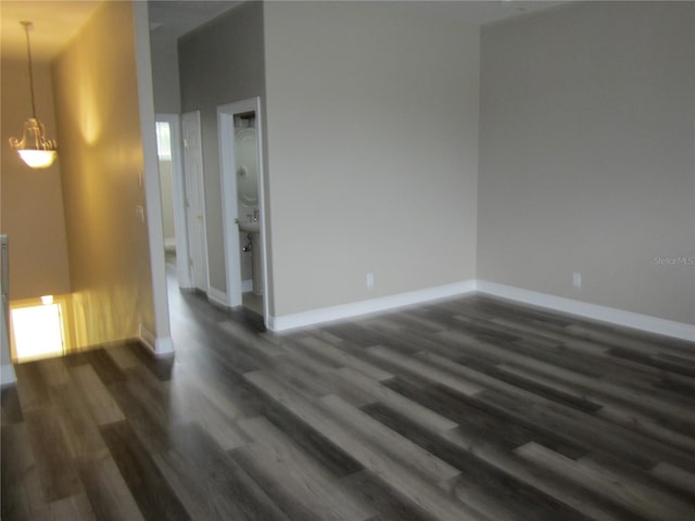 unfurnished room featuring dark hardwood / wood-style flooring