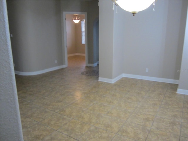 spare room with tile flooring