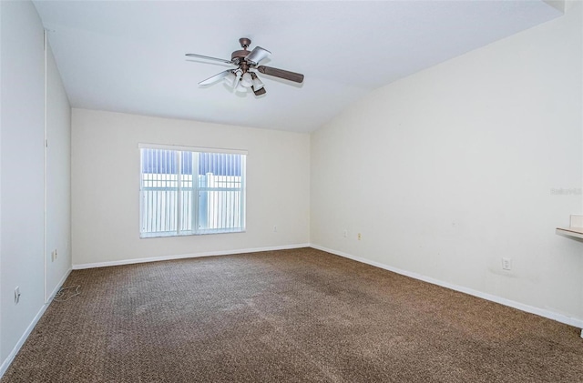 carpeted empty room featuring ceiling fan and lofted ceiling