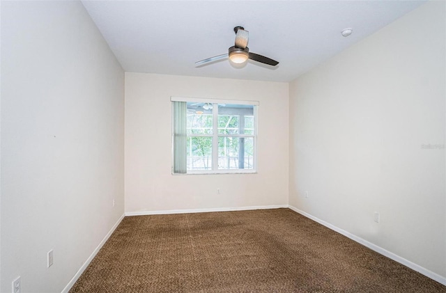 empty room featuring carpet flooring and ceiling fan