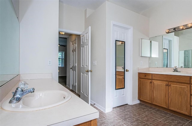 bathroom featuring tile flooring and vanity