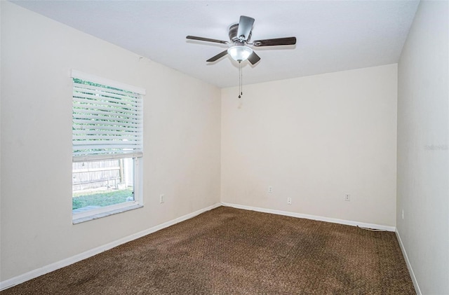 empty room with carpet floors and ceiling fan