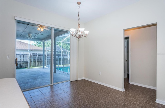 tiled empty room with ceiling fan with notable chandelier