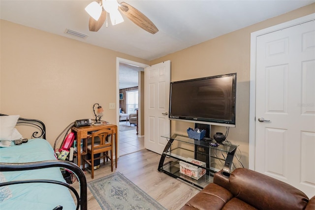 bedroom with ceiling fan and light wood-type flooring