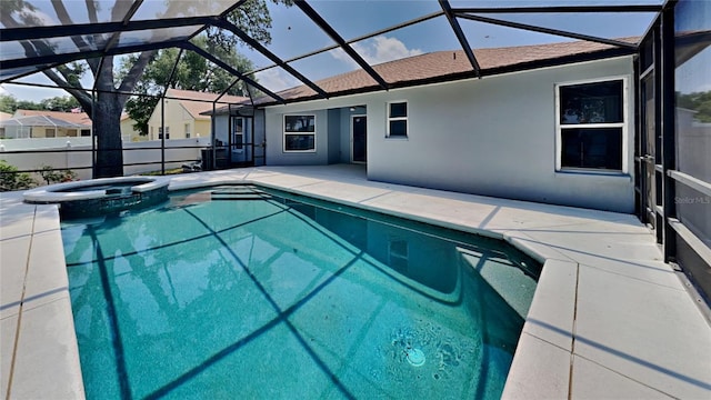 view of swimming pool with a lanai and a patio area