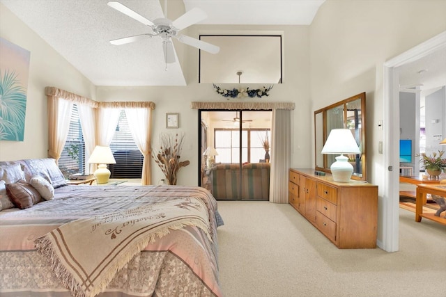 bedroom featuring ceiling fan, carpet floors, a textured ceiling, and vaulted ceiling