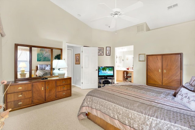 carpeted bedroom with a high ceiling and ceiling fan