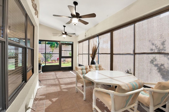 sunroom / solarium featuring ceiling fan and lofted ceiling