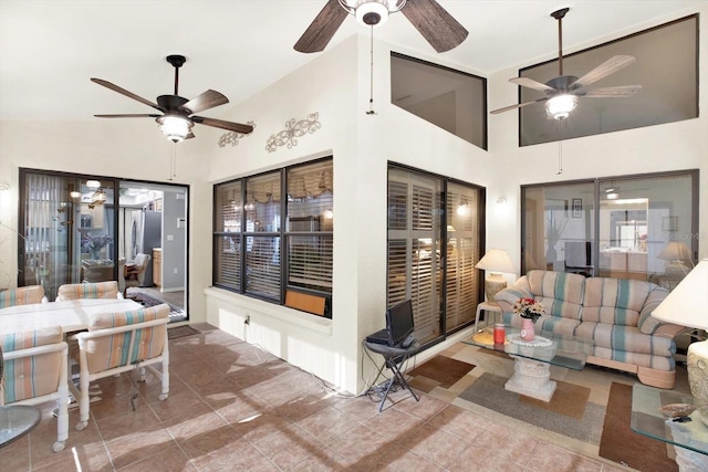 sunroom / solarium with ceiling fan and vaulted ceiling