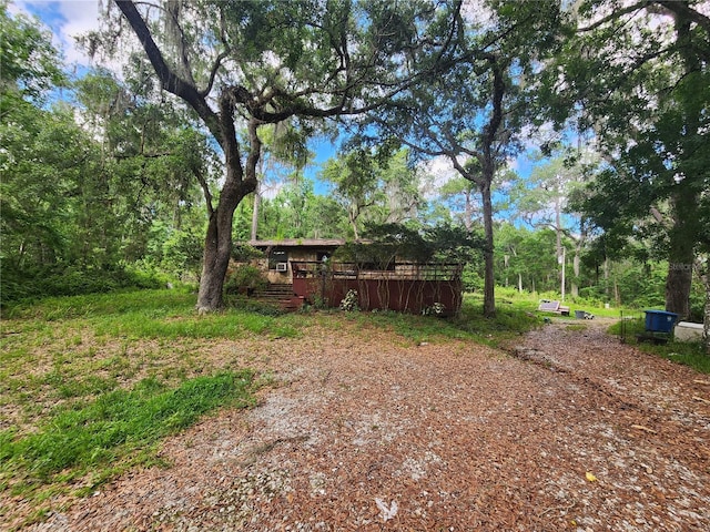 view of yard featuring a wooden deck