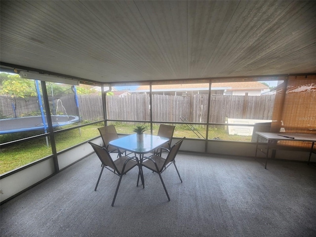 unfurnished sunroom featuring wood ceiling