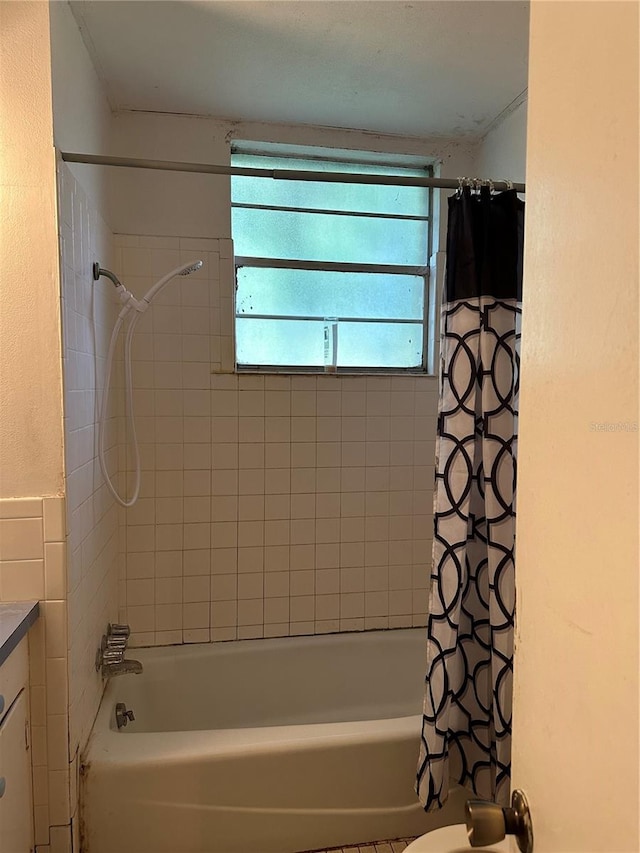 bathroom with vanity and shower / tub combo