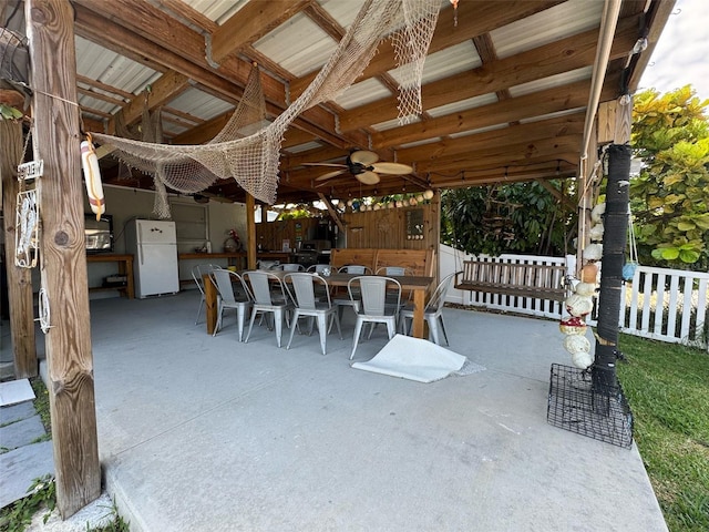 view of patio featuring ceiling fan