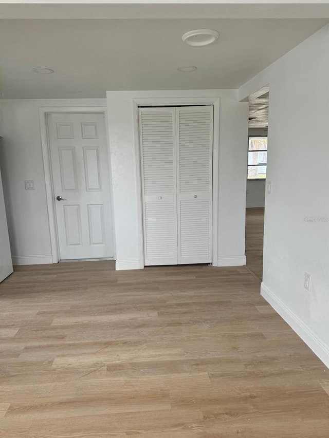 unfurnished bedroom with light hardwood / wood-style floors