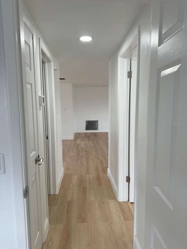 corridor featuring light hardwood / wood-style floors