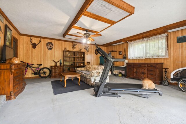 exercise area featuring wood walls