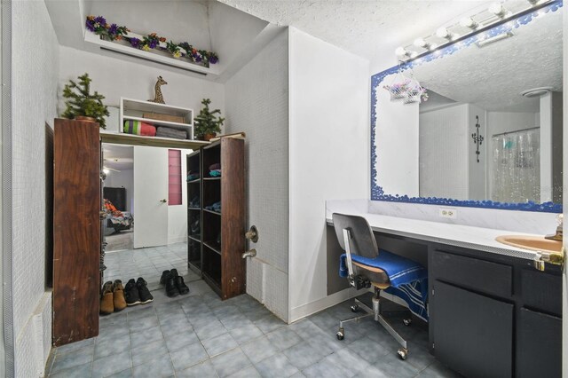 office area featuring a textured ceiling