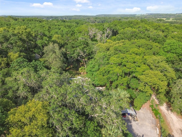 birds eye view of property with a forest view