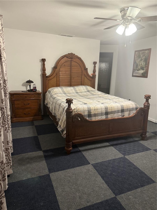 bedroom with ceiling fan and visible vents