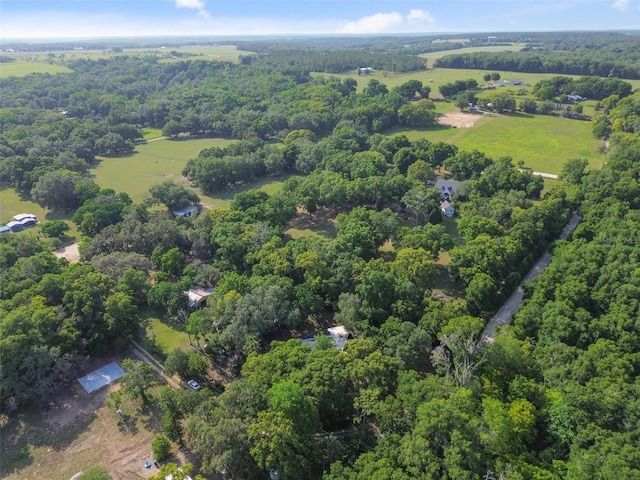 drone / aerial view featuring a forest view