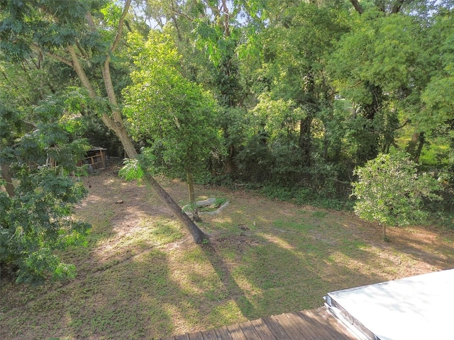 view of yard with a forest view