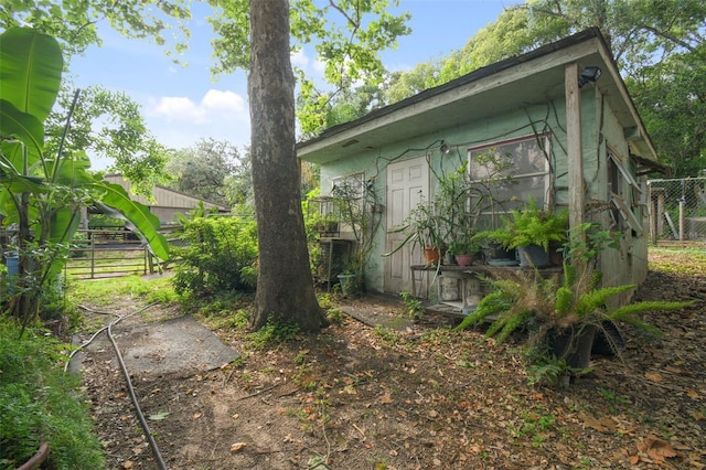view of property exterior with fence