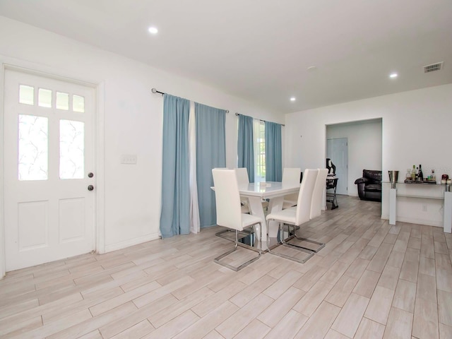 unfurnished dining area featuring light hardwood / wood-style flooring