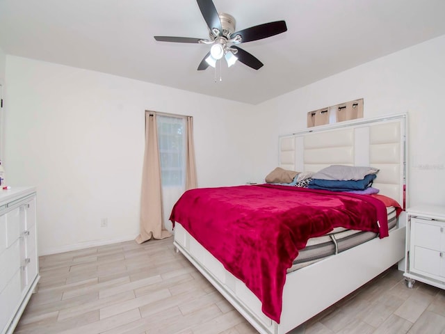 bedroom featuring ceiling fan and light wood-type flooring