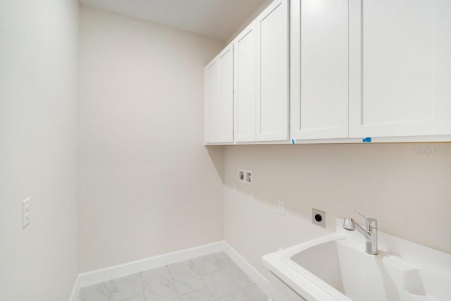 laundry area featuring hookup for a washing machine, hookup for an electric dryer, baseboards, marble finish floor, and cabinet space