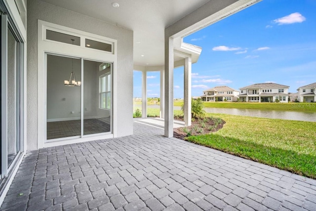 view of patio / terrace featuring a water view