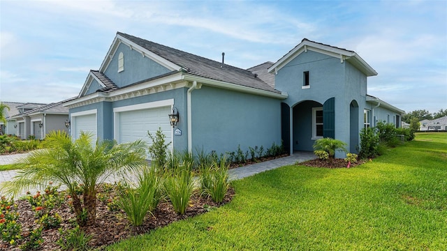 exterior space featuring a front yard and a garage