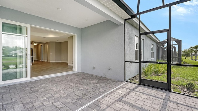 unfurnished sunroom with a healthy amount of sunlight