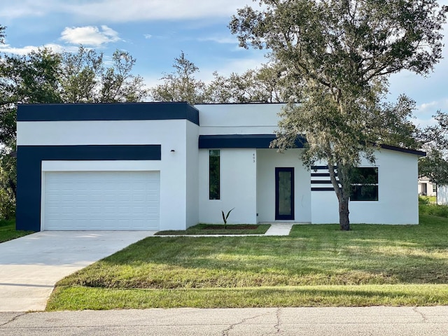 contemporary house with a front lawn and a garage