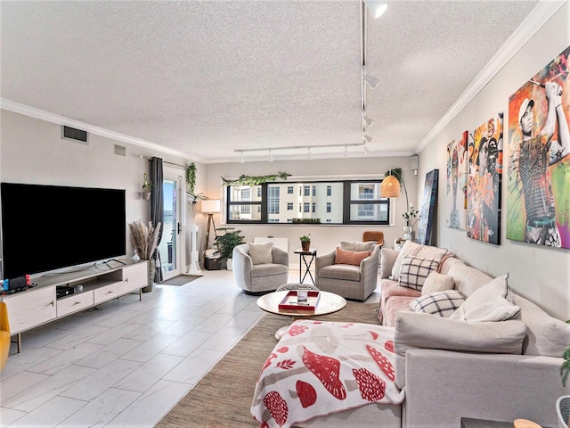 tiled living room featuring a textured ceiling, track lighting, plenty of natural light, and ornamental molding