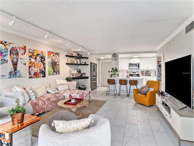 living room featuring crown molding, a textured ceiling, track lighting, and light tile flooring