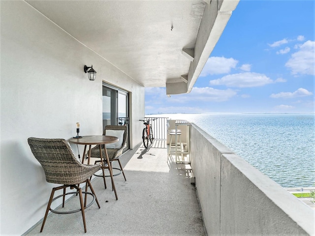 balcony featuring a water view